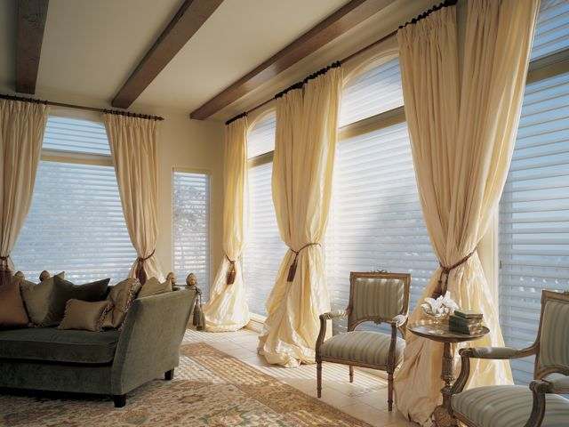 Silhouette® window shadings with drapes for a traditional look.